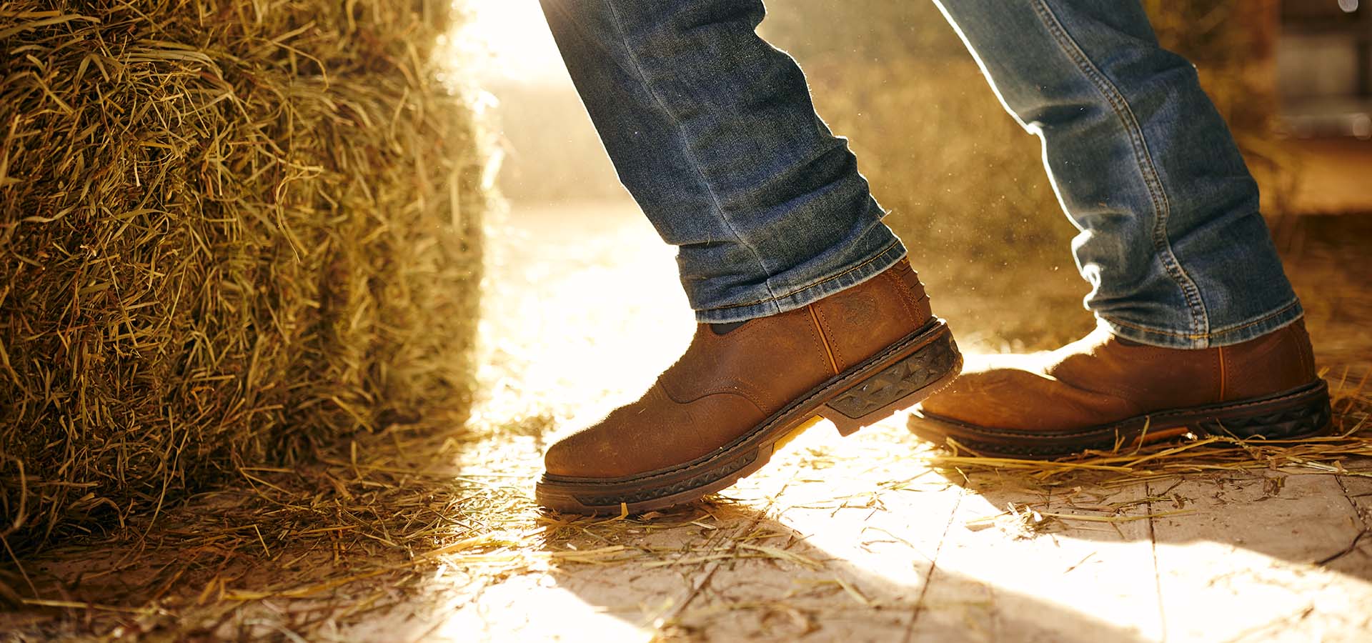 Worker in barn wearing GEORGIA BOOT Carbo-Tec LT Boots